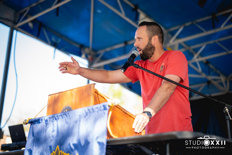 Austin Arthur speaking on stage