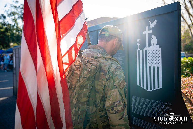 A soldier at the memorial wall